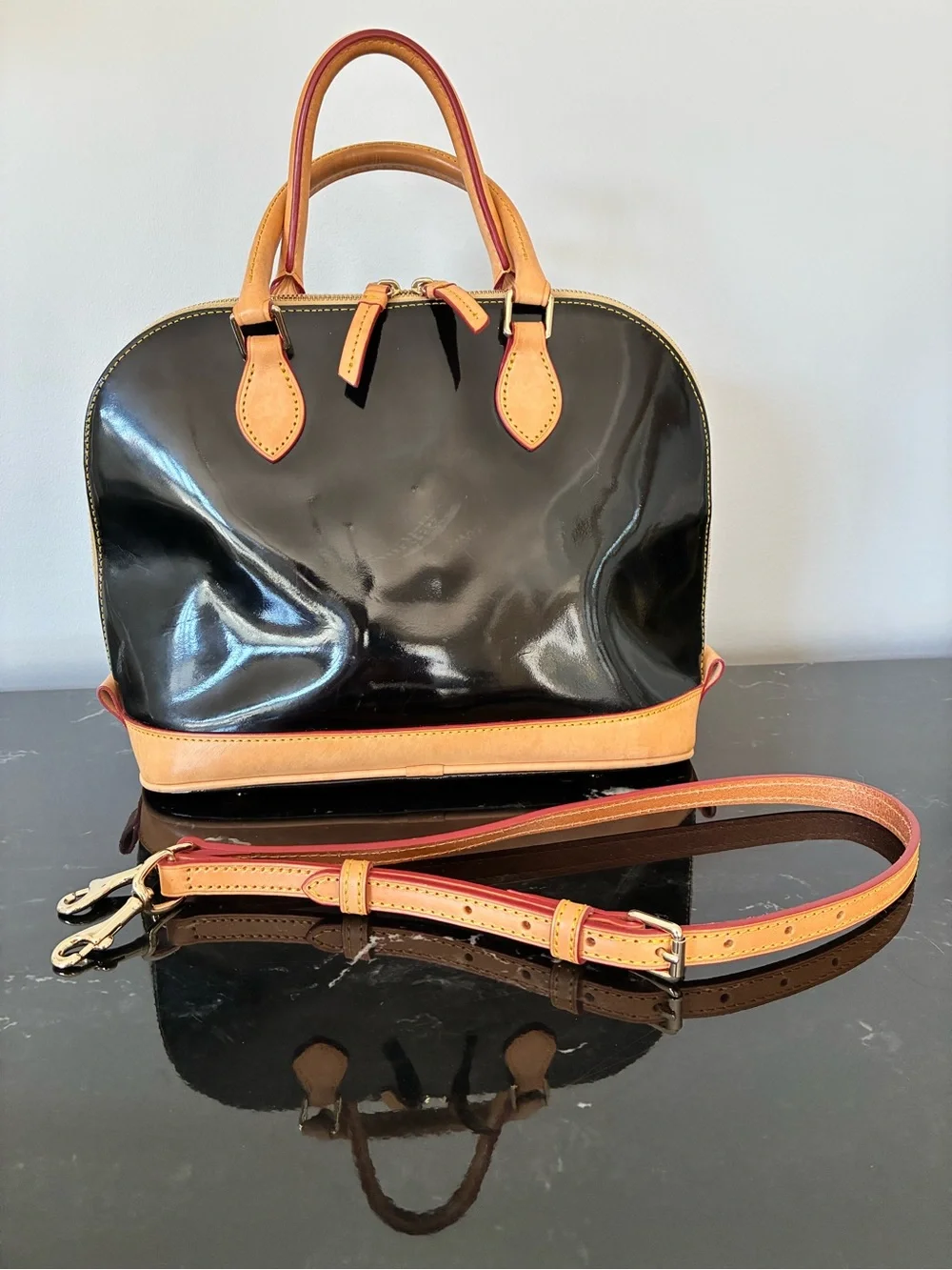 Dooney & Bourke Black Patent Satchel with Cream Trim and Red Accents
